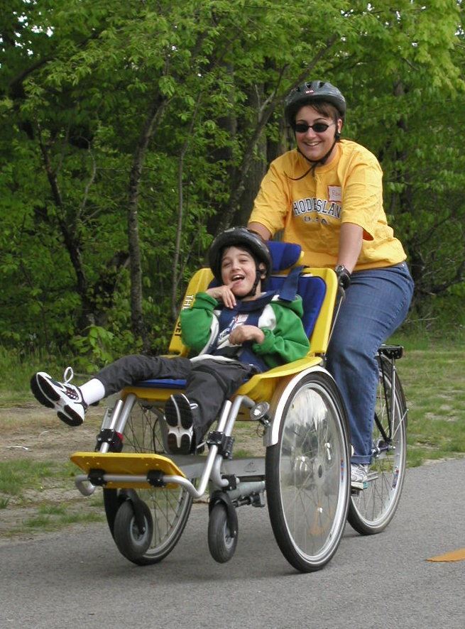 Two people using the Kids Connect Duet Bike